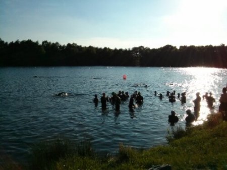 Swimmers preparing for the open water swim in ideal conditions