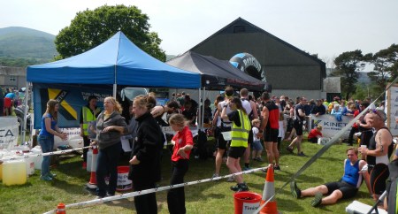 Welcoming marshals, free food, drink, and a Slateman 2014 coaster made of Welsh slate await finishers